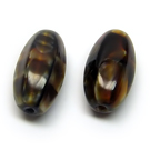 Stiklas tamsios karamelės spalvos margas šešiabriaunio ovalo formos 15x7 mm