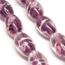 Lampwork karoliukas su sidabro folija ir gėlyte alyvinės spalvos 16x10 mm