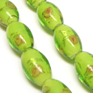 Lampwork karoliukas su sidabro folija ir gėlyte salotinės spalvos 16x10 mm